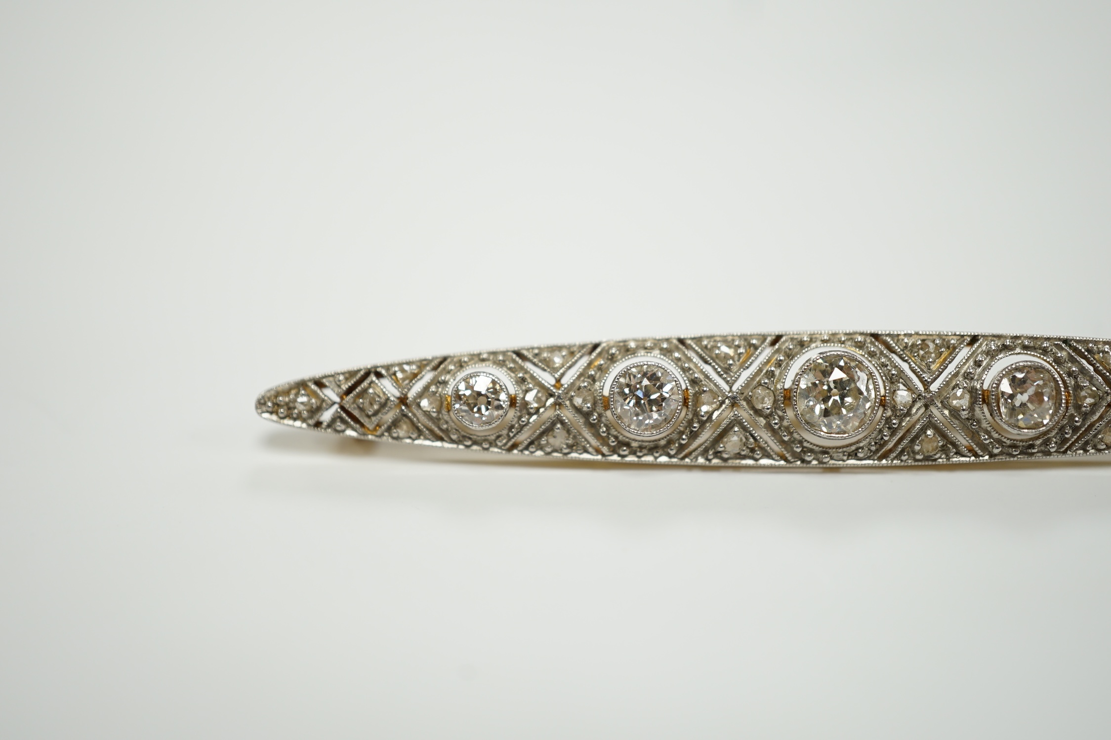 A Belle Epoque yellow and white metal mounted diamond cluster set navette shaped bar brooch, 69mm, gross weight 6.5 grams.